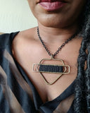 BLACK AND BRASS PROTECTIVE SHIELD NECKLACE