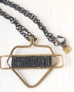 BLACK AND BRASS PROTECTIVE SHIELD NECKLACE