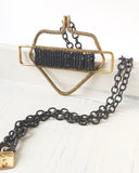 BLACK AND BRASS PROTECTIVE SHIELD NECKLACE