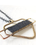 BLACK AND BRASS PROTECTIVE SHIELD NECKLACE